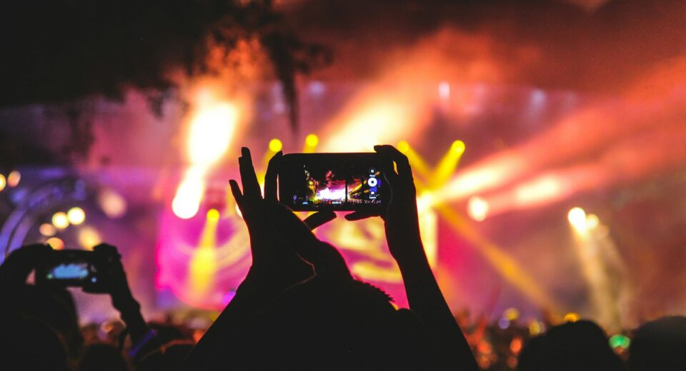 Praise lyrics meaning - Elevation Worship concert stage bathed in purple light