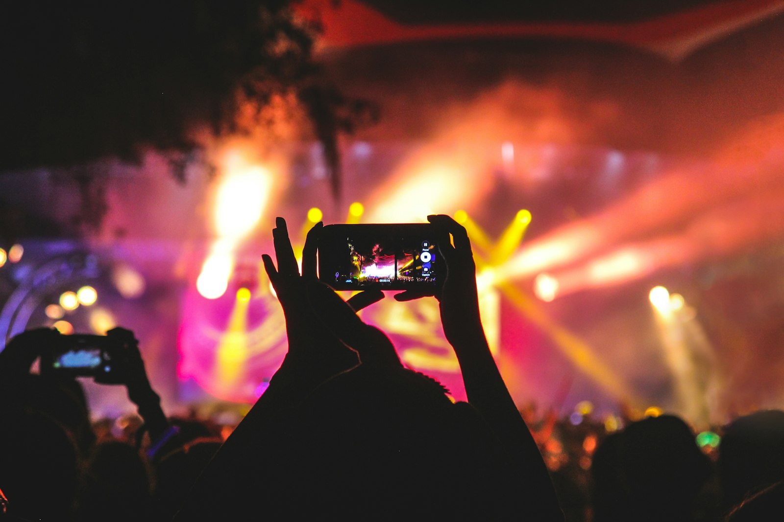 Praise lyrics meaning - Elevation Worship concert stage bathed in purple light