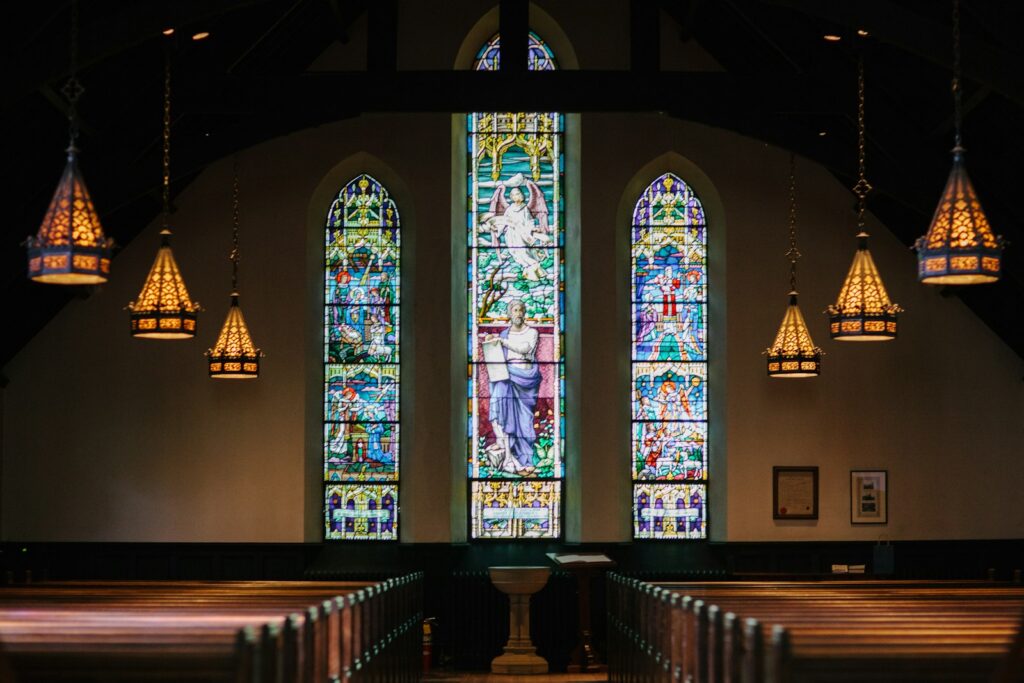 Alpha and Omega lyrics meaning - church interior with light streaming through windows
