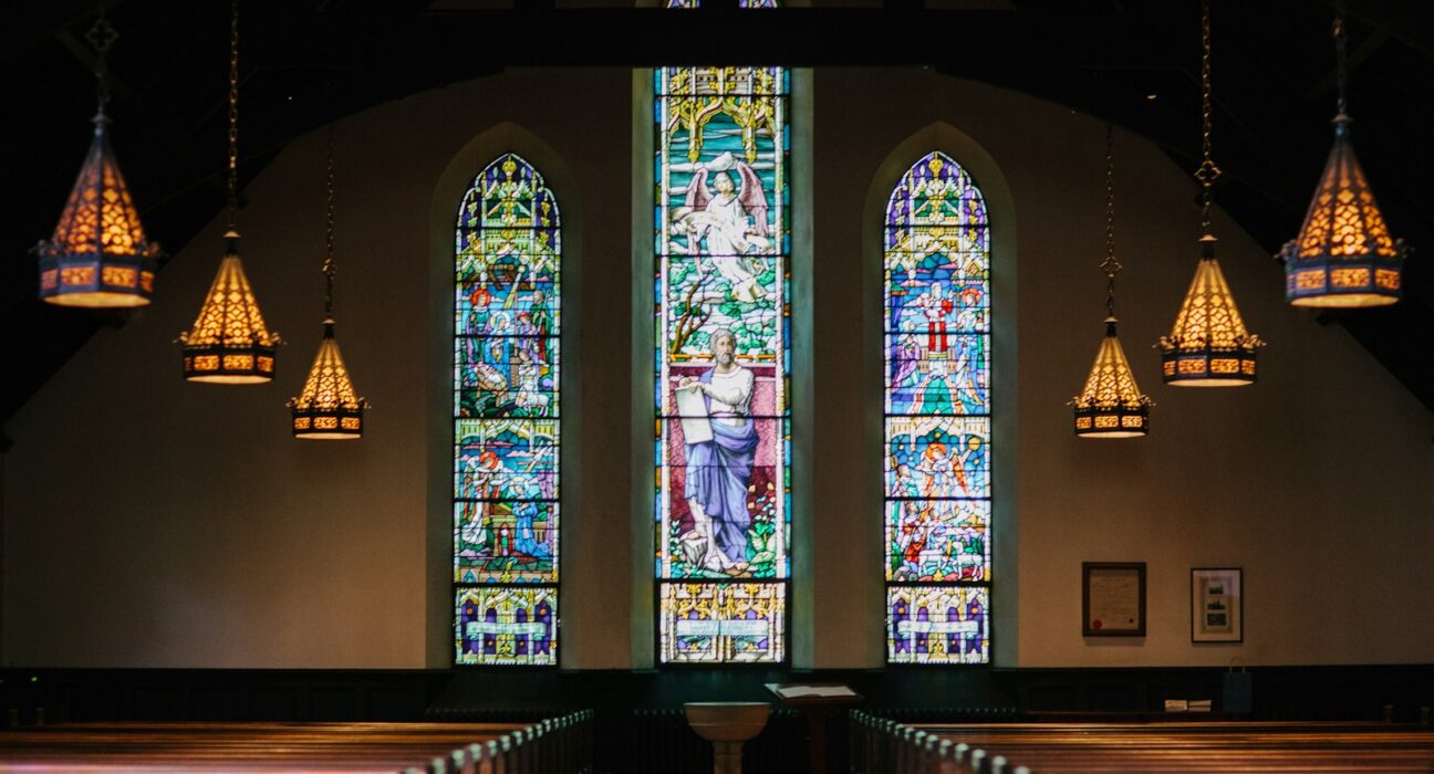 Alpha and Omega lyrics meaning - church interior with light streaming through windows